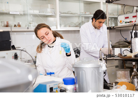Female chemist writing results of experiments Female chemist writing results of experiments 53010117