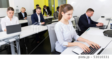 Business people working in coworking space Business people working in coworking space 53010331
