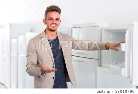 man choosing new refrigerator man choosing new refrigerator 53010796