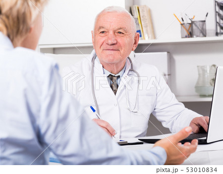 Male doctor with female client 53010834