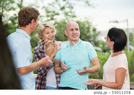 glad pensioners talking in the park glad pensioners talking in the park 53011358