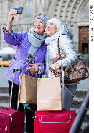 Elderly women tourists making selfie with phone Elderly women tourists making selfie with phone 53012199