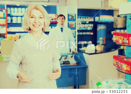 Female customer in pharmacy drugstore . Female customer in pharmacy drugstore . 53012255