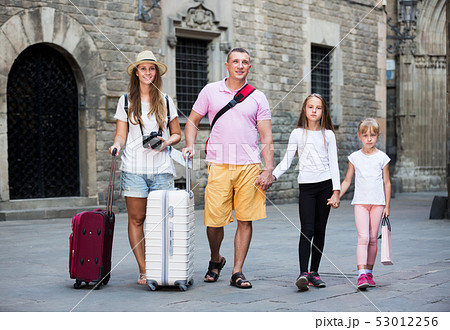 Big family of tourists strolling Big family of tourists strolling 53012256