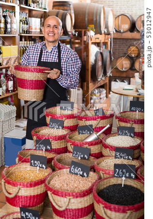 man selling dried beans man selling dried beans 53012947