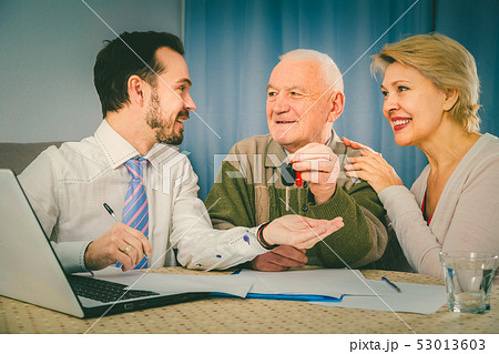 Old man and mature woman signing contract car lease Old man and mature woman signing contract car lease 53013603