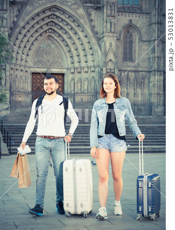 Attractive couple going the historic city center 53013831
