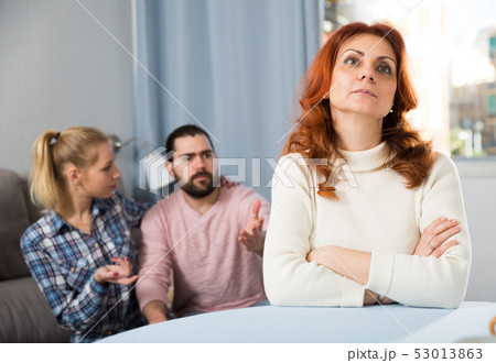 Young serious couple has a family stressful conversation at home Young serious couple has a family stressful conversation at home 53013863