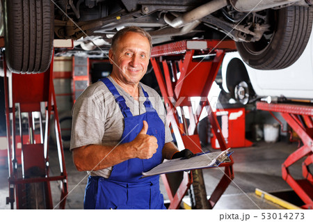 auto mechanic recording list of works on car repair auto mechanic recording list of works on car repair 53014273