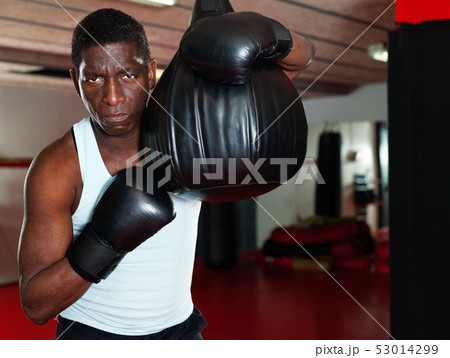 Potrait of african american boxer who is training in gym Potrait of african american boxer who is training in gym 53014299