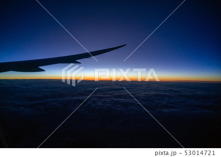Scene of Airplane wing over the cloud and fantastic sky at sunrise time when flying above the land, Nature and travel concept Scene of Airplane wing over the cloud and fantastic sky at sunrise time when flying above the land, Nature and travel concept 53014721