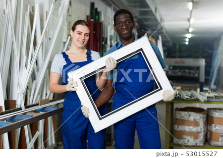 Adult masters are holding modern window frames Adult masters are holding modern window frames 53015527