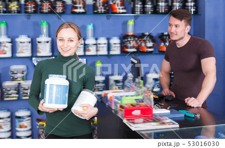 Portrait of girl with sport food supplements Portrait of girl with sport food supplements 53016030