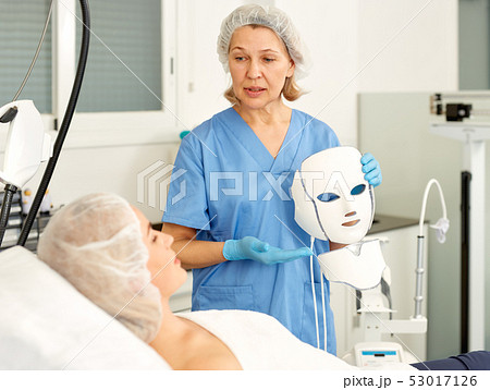 Modern plastic surgeon preparing for operation Modern plastic surgeon preparing for operation 53017126