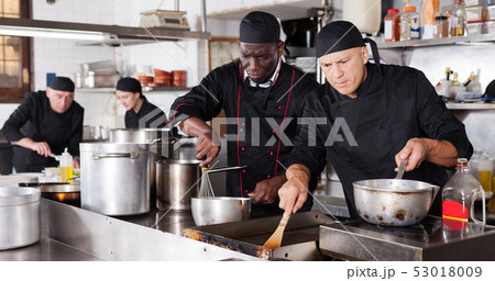 Professional male chef in kitchen of restaurant 53018009