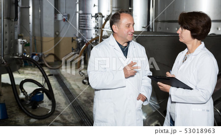 Man and woman check of equipment Man and woman check of equipment 53018963