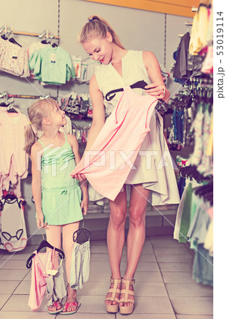 mother with daughter holding wear mother with daughter holding wear 53019114