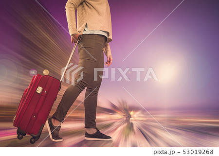 Girl with suitcase on wheels 53019268