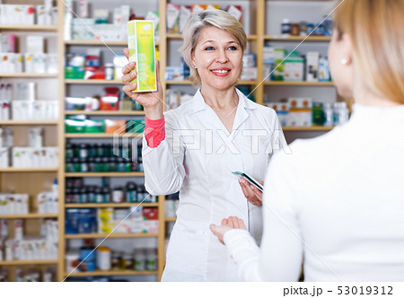 Laughing seller recommending care products 53019312
