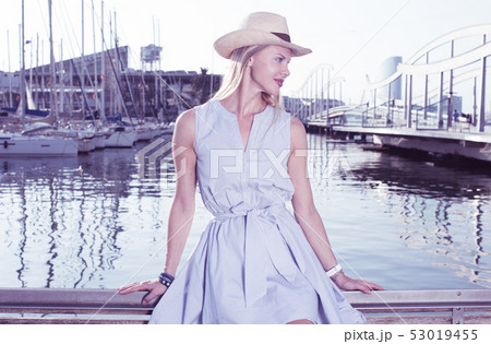 Portrait of smiling woman sitting in the hat Portrait of smiling woman sitting in the hat 53019455
