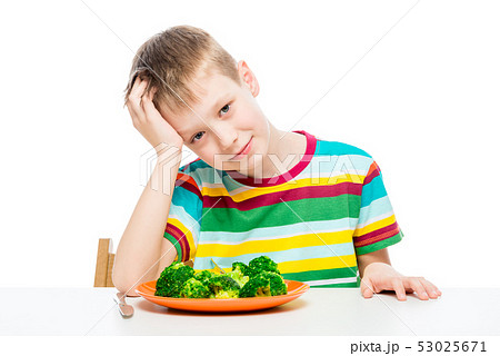 Child and a plate of broccoli, concept photo food 53025671