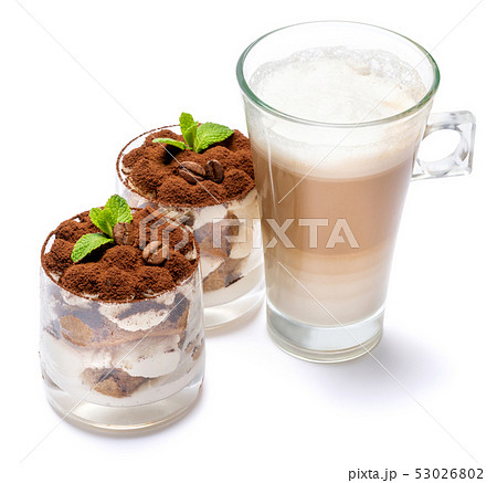 Classic tiramisu dessert in a glass and cup of coffee isolated on a white background with clipping Classic tiramisu dessert in a glass and cup of coffee isolated on a white background with clipping 53026802