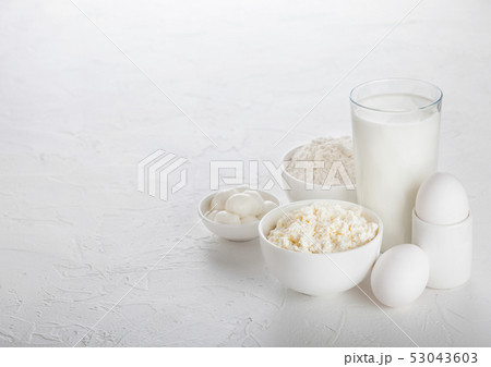 Fresh dairy products on white table background. Fresh dairy products on white table background. 53043603