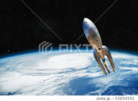 vintage metal spaceship is flying near the earth. vintage metal spaceship is flying near the earth. 53054591