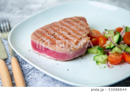 Grilled tuna steak with vegetables. Grilled tuna steak with vegetables. 53086644