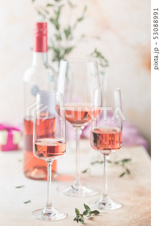 Glasses and bottle of rose wine 53088991