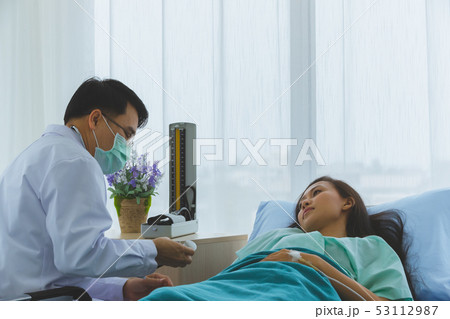 Asian doctor check the sickness of female Asian doctor check the sickness of female 53112987