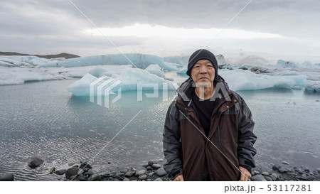 Asian senior man with Iceland glacier landscape Asian senior man with Iceland glacier landscape 53117281