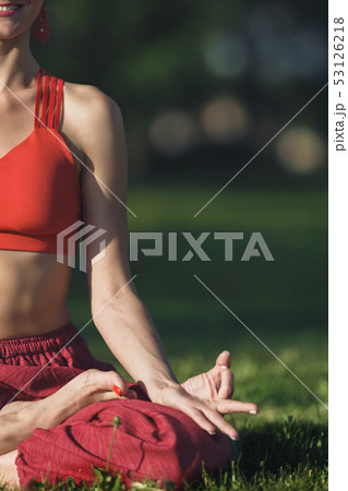 Young woman practicing yoga outdoors. Female meditate outdoor in the summer city park. Hands coseup 53126218
