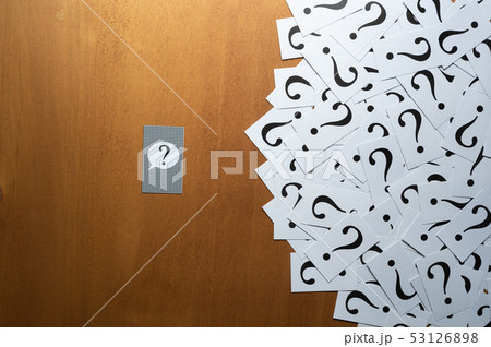 Question mark heap on table concept for confusion, Question mark heap on table concept for confusion, 53126898