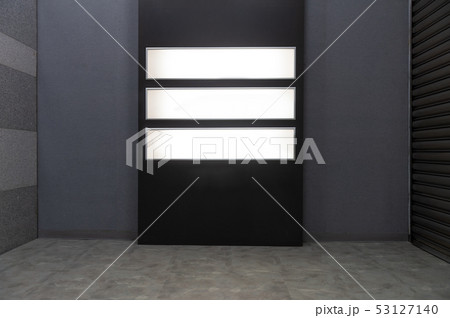 Large blank billboard on a street wall, banners 53127140