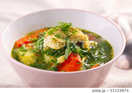 Tasty soup with chicken and vegetables. closeup 53129974