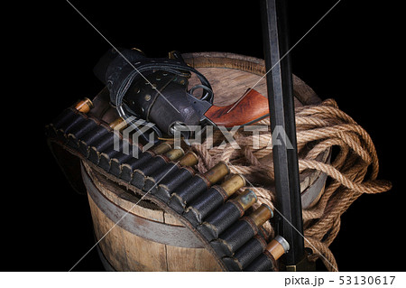 Old wild west gun with cartridges and gunbelt Old wild west gun with cartridges and gunbelt 53130617