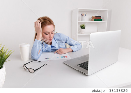Picture of tired businesswoman working laptop. Office girl feeling sleepy. Picture of tired businesswoman working laptop. Office girl feeling sleepy. 53133326