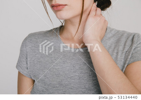 Close up picture of young woman with neckache isolated. Close up picture of young woman with neckache isolated. 53134440