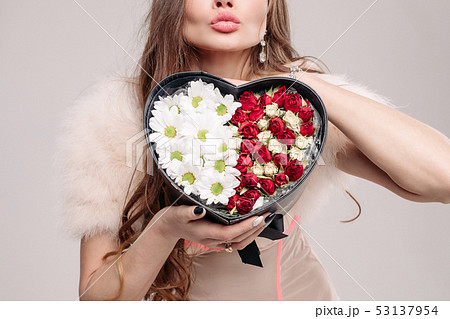 Unrecognizable caucasian model with box of 53137954