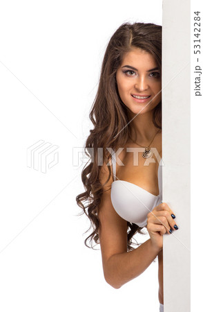 Closeup portrait of pretty woman looking from corner Closeup portrait of pretty woman looking from corner 53142284
