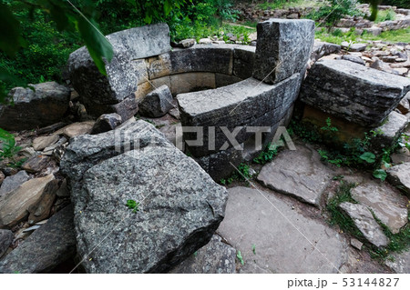 Ancient round ruined dolmen in the valley of the 53144827