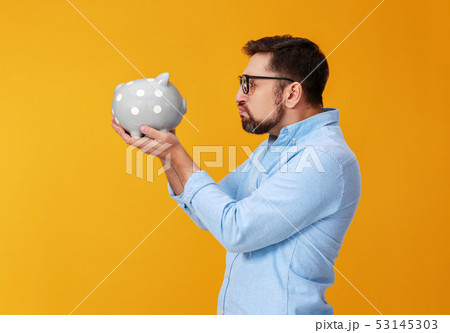 concept of Finance and business. man with piggy concept of Finance and business. man with piggy 53145303