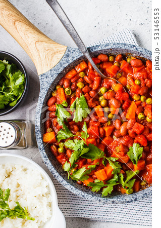 Vegan bean stew with tomatoes and rice in a pan Vegan bean stew with tomatoes and rice in a pan 53146553