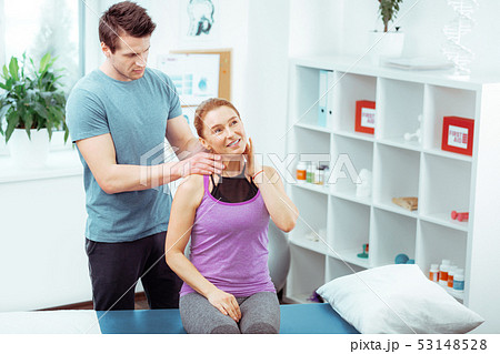 Nice serious man doing a professional neck massage 53148528