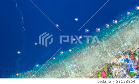 Aerial view of Filipino boats floating on sea. Aerial view of Filipino boats floating on sea. 53153854