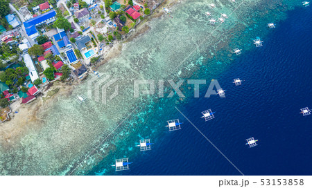 Aerial view of Filipino boats floating on sea. Aerial view of Filipino boats floating on sea. 53153858