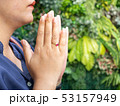 Young woman praying hand on Temple,Background plan 53157949