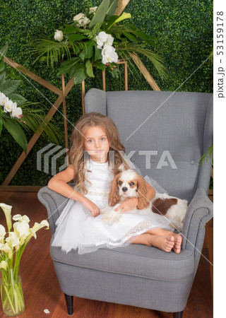 Little cute girl with blond hair in a white dress Little cute girl with blond hair in a white dress 53159178
