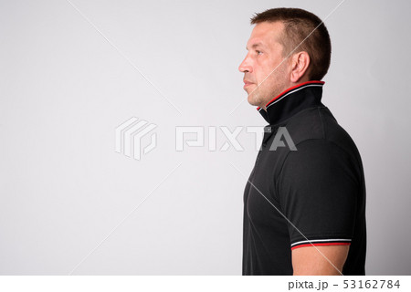 Profile view of macho mature man looking strong and muscular Profile view of macho mature man looking strong and muscular 53162784